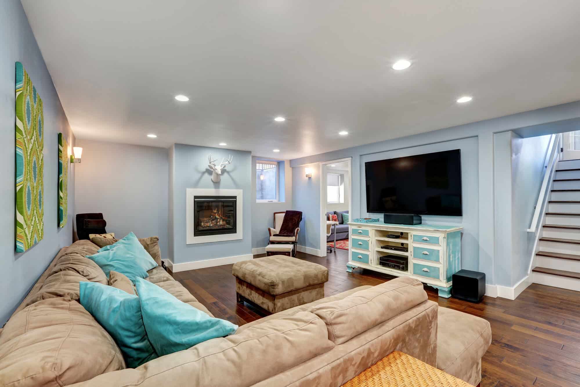 Pastel blue walls in basement living room interior. brighten a basement, Fredericksburg